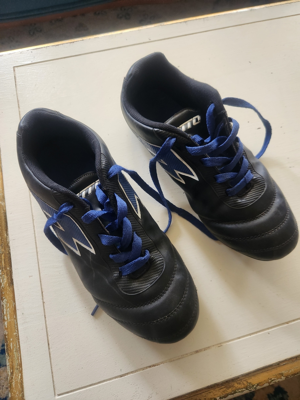 Kids Black Soccer Cleats with Blue Accents